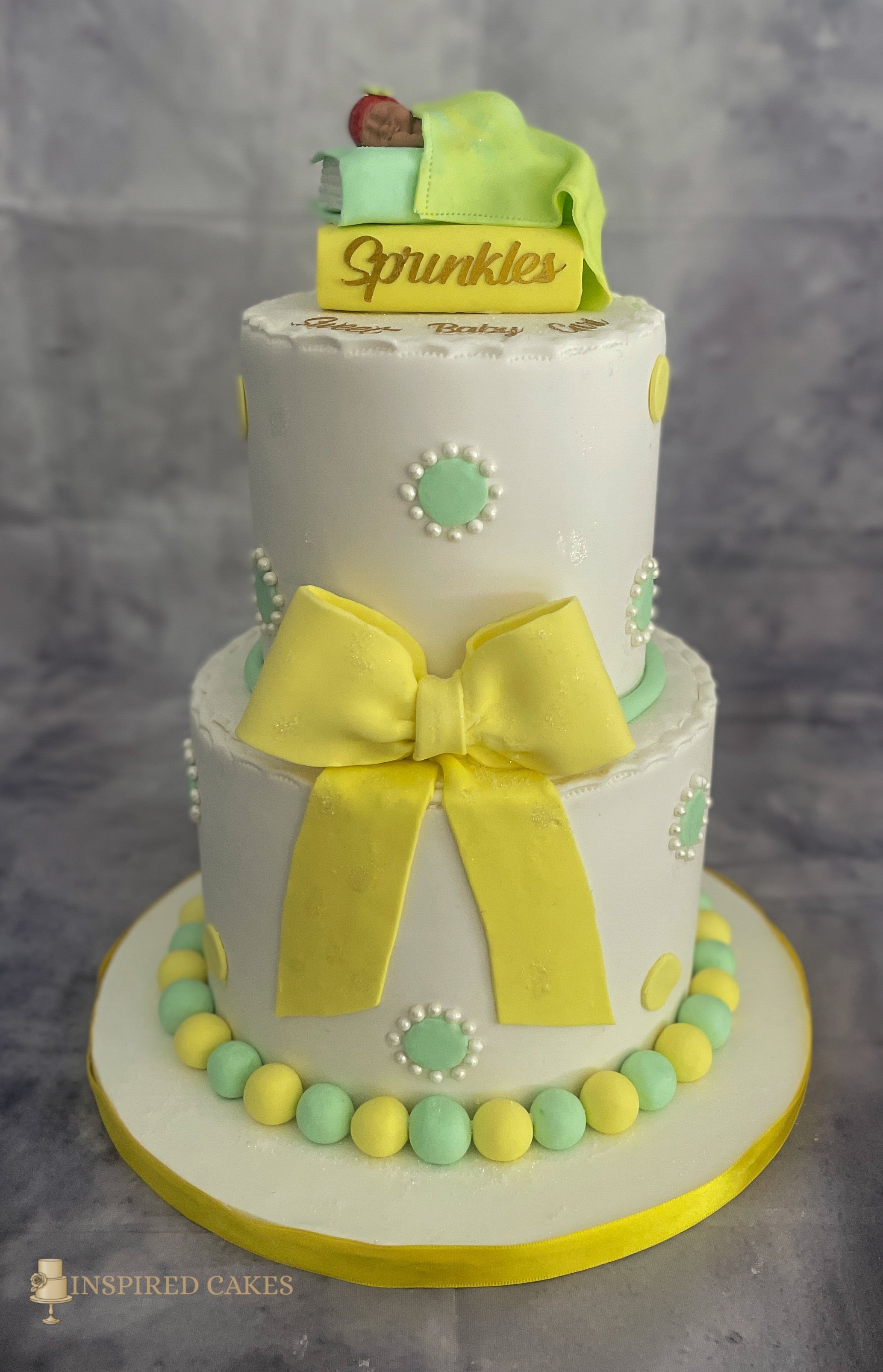2 tier baby shower cake with sleeping baby