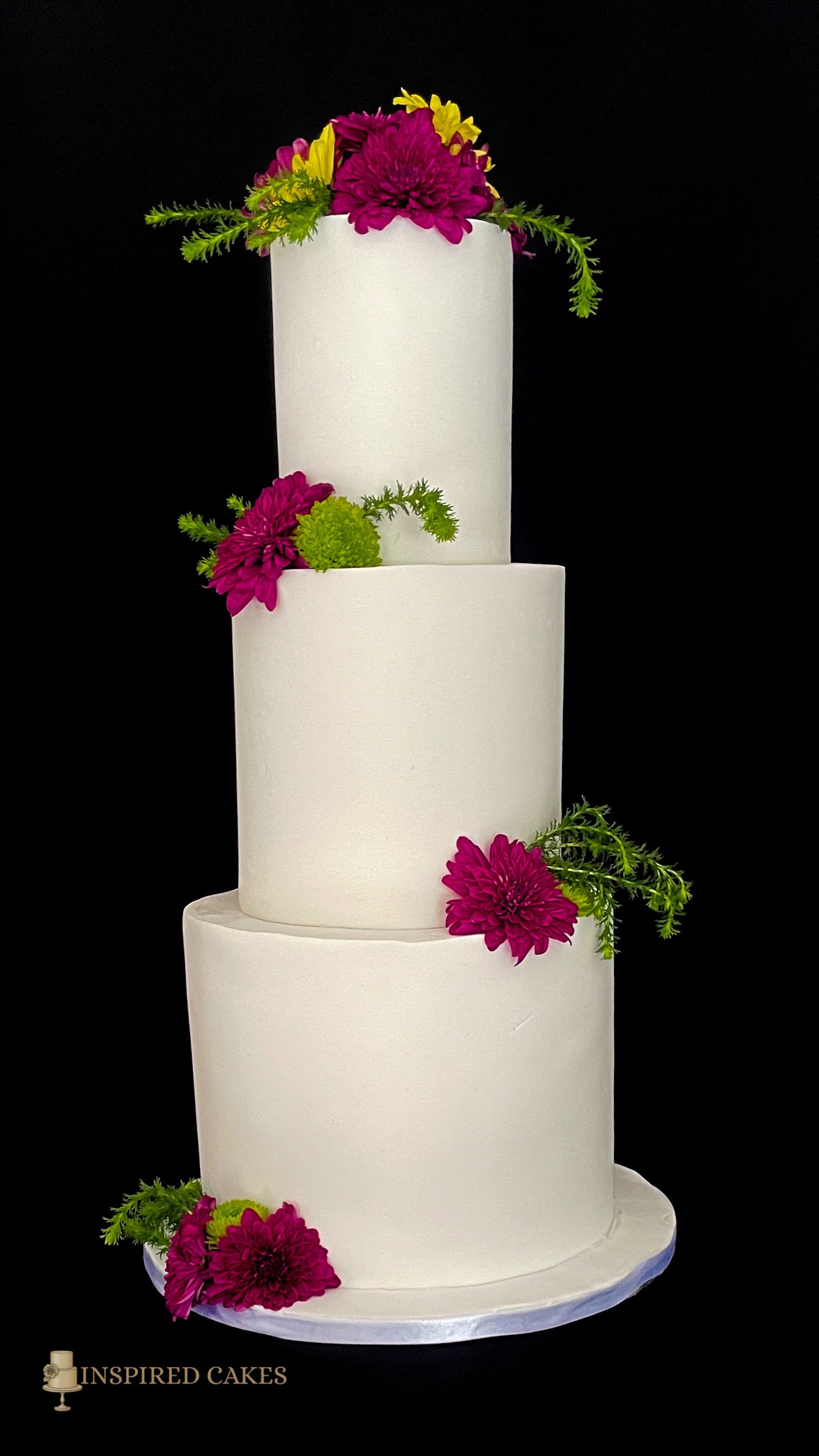 3 tier wedding white cake with fresh flowers