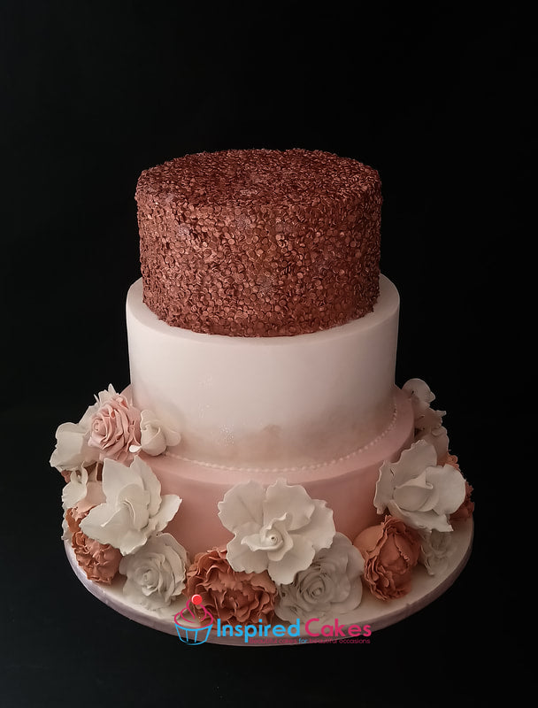 3 tier wedding cake with rose gold sequins and sugar lowers