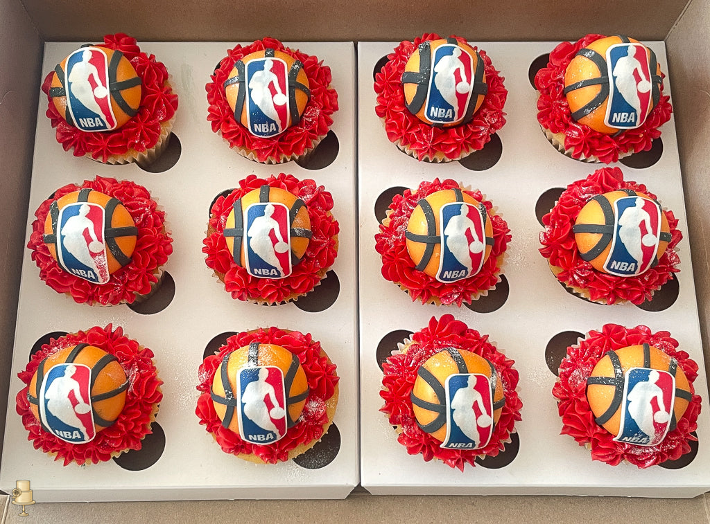 Cupcakes with NBA logo and basketball design on a white tray