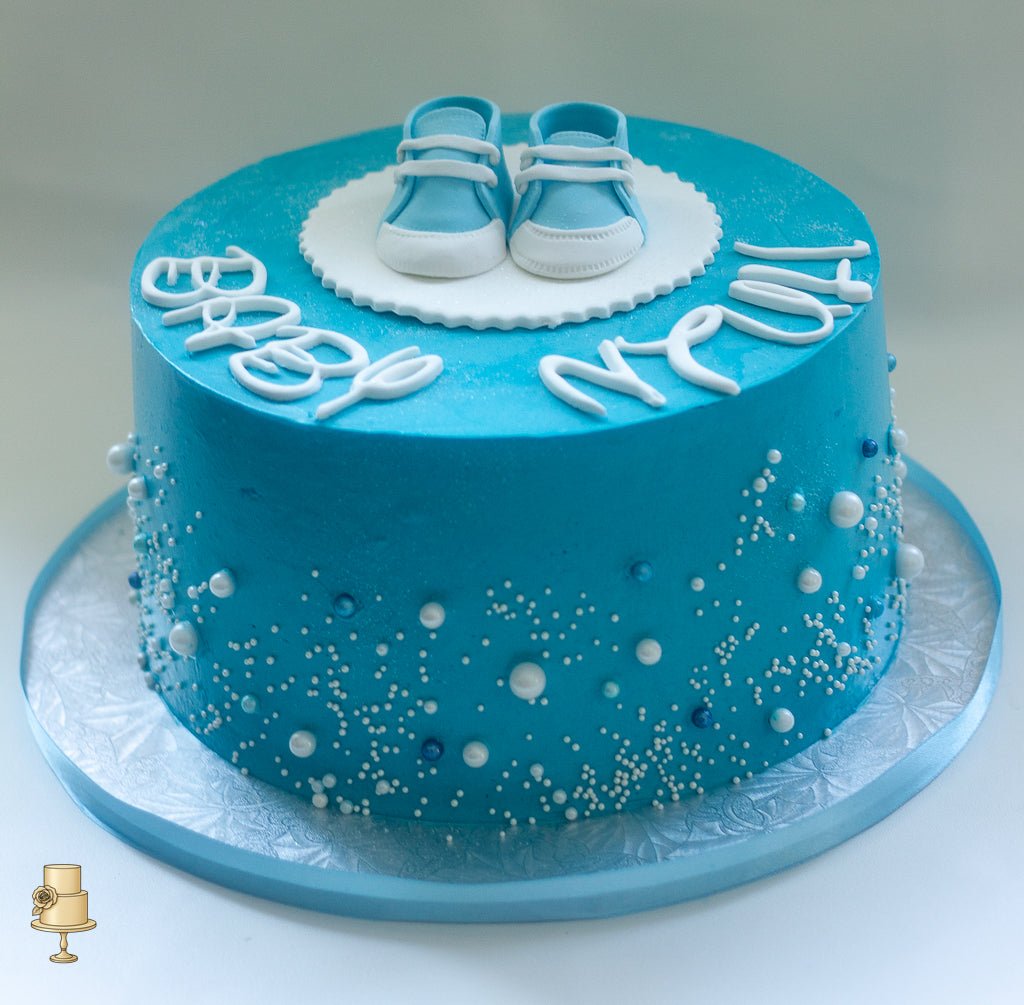 Buttercream baby booties baby shower cake