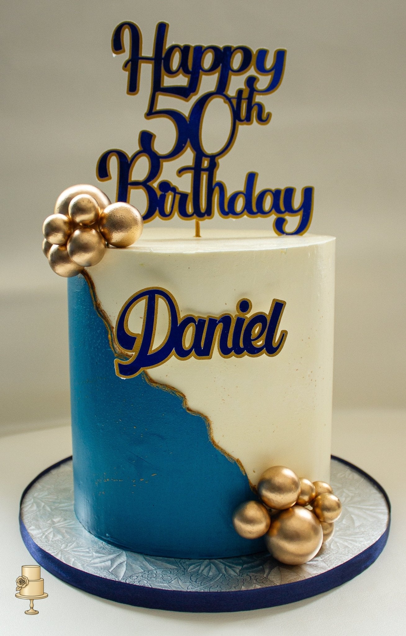 Buttercream birthday cake with gold pearl balls