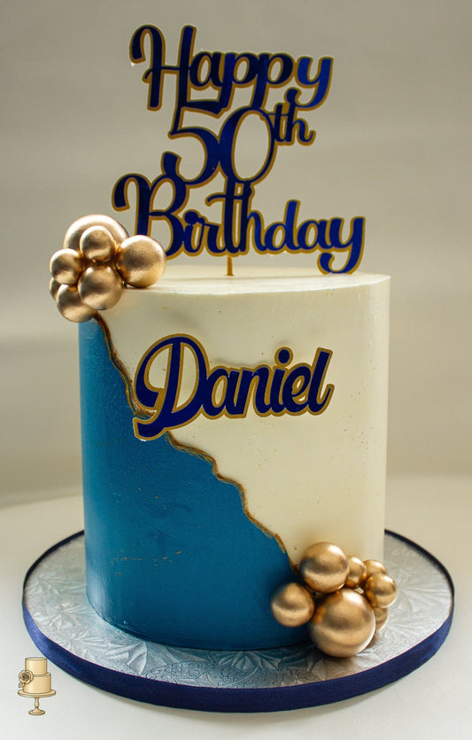 Buttercream birthday cake with gold pearl balls