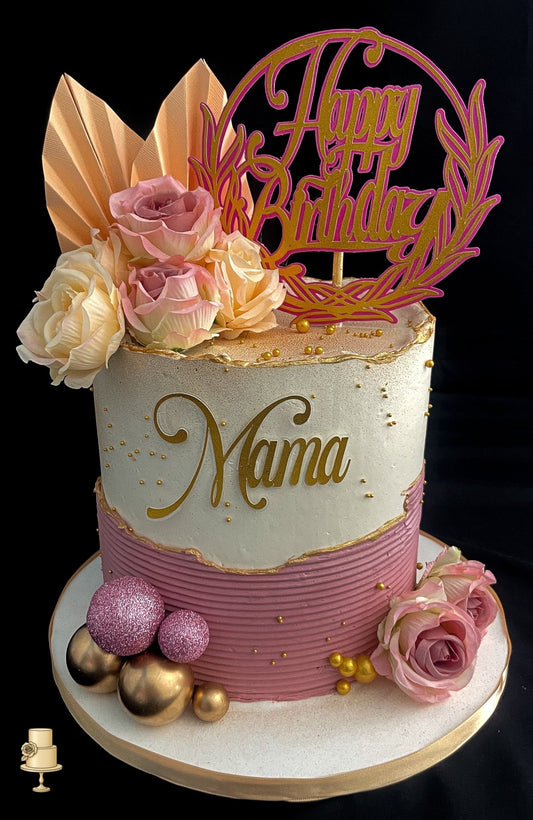 Elegant birthday cake with flowers and 'Happy Birthday Mama' topper 