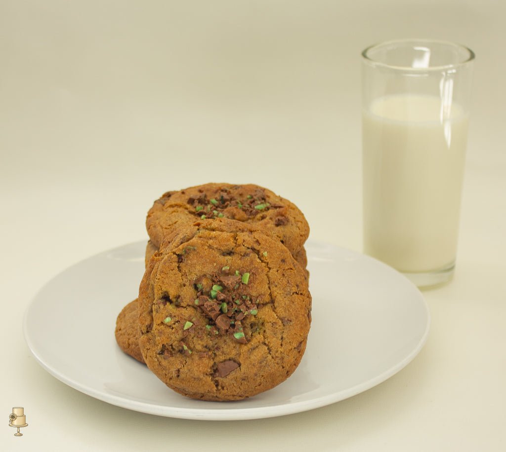 pepper mint crisp cookies on a plate with glass of milk