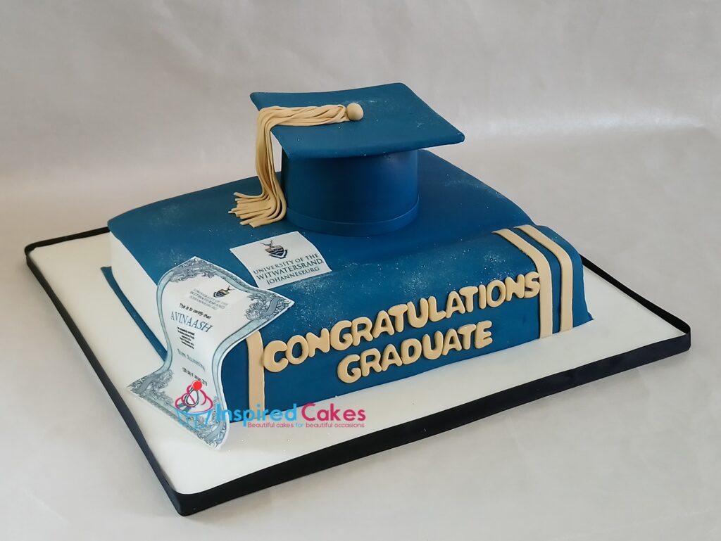 Graduation book and cap cake