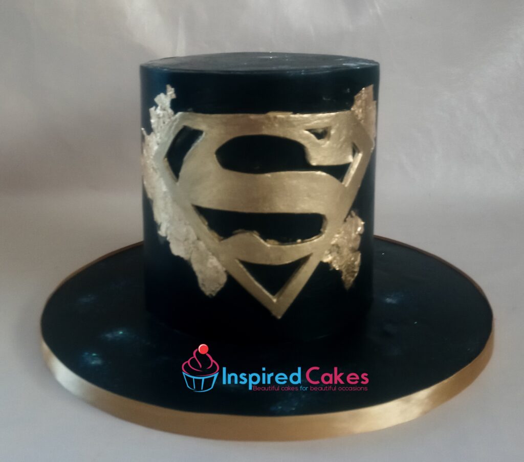 black and gold superman cake