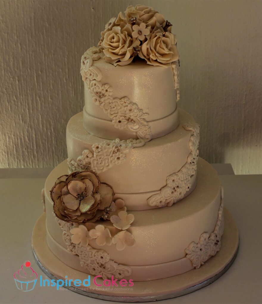 3 tier wedding cake with lace applique design