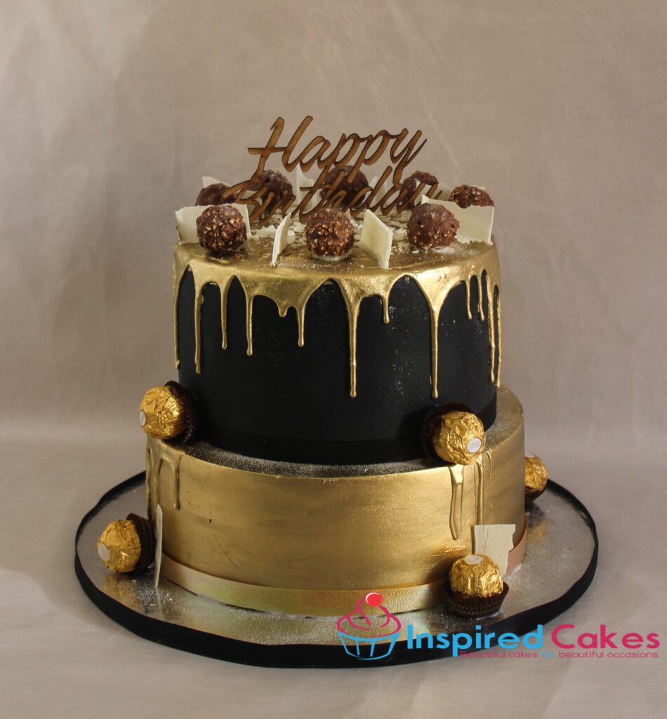 Black and gold 2 tier cake with gold drip