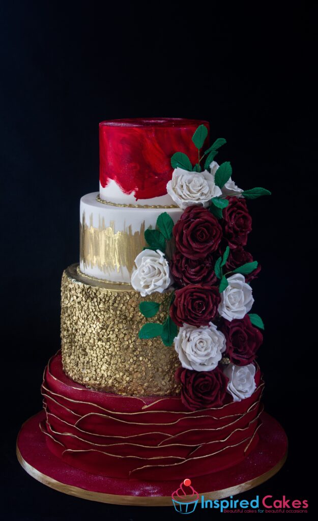 4 tier wedding cake gold sequin sugar roses