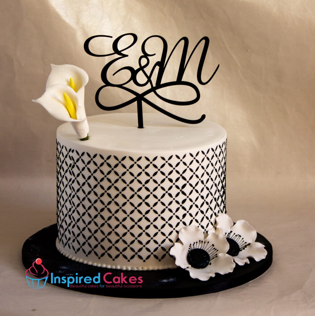 Elegant simple wedding cake with stencil design sugar lily flower