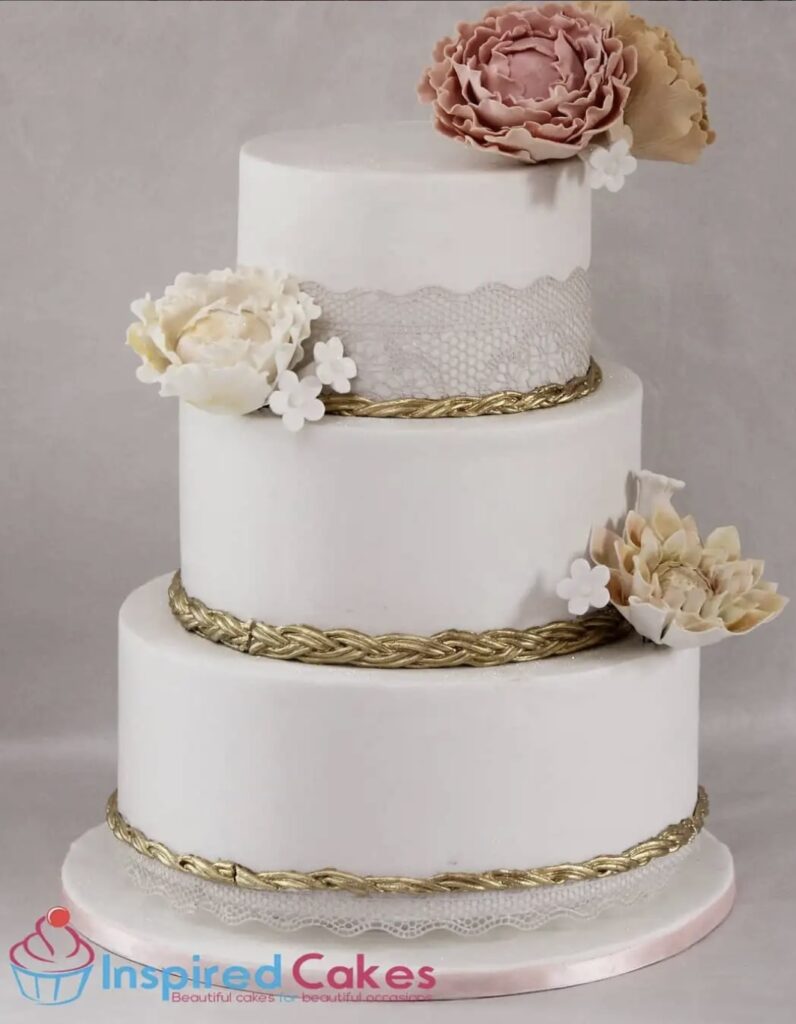 3 tier wedding cake with gold borders