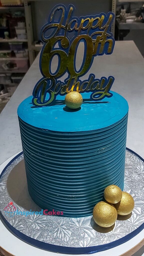 Blue and gold birthday cake