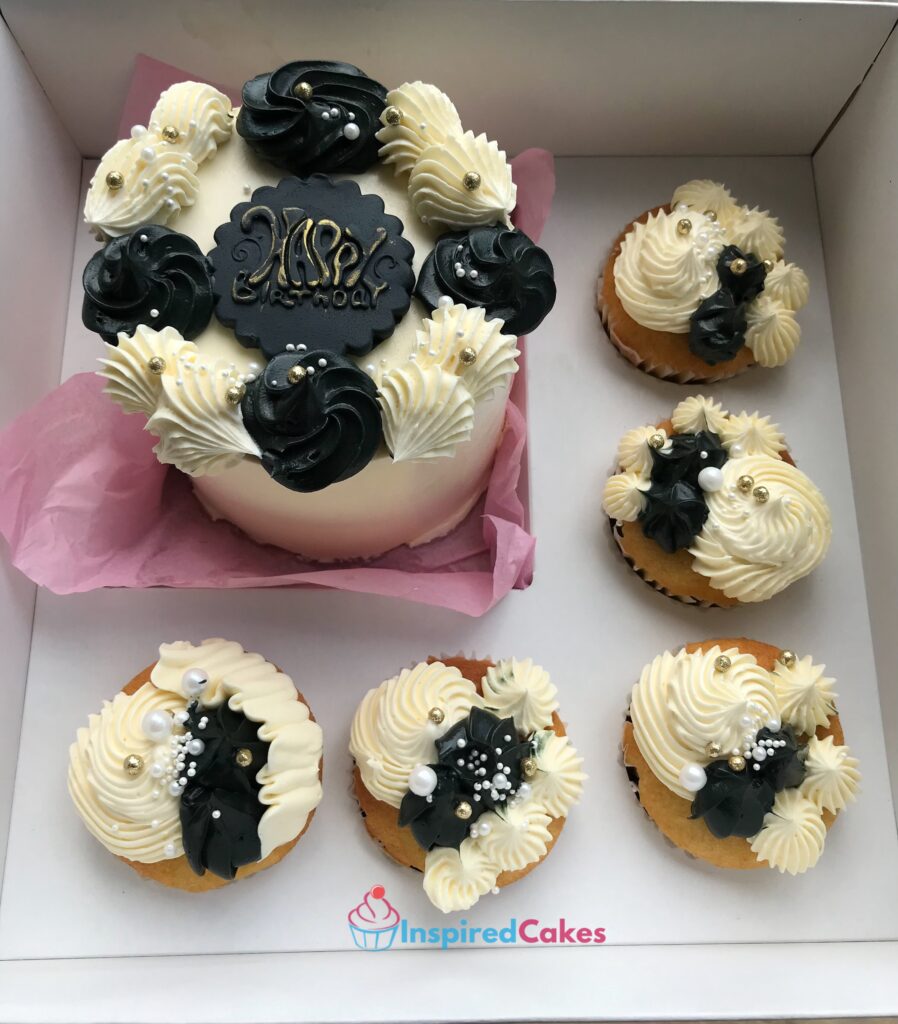 Black and white bento cake and cupcakes